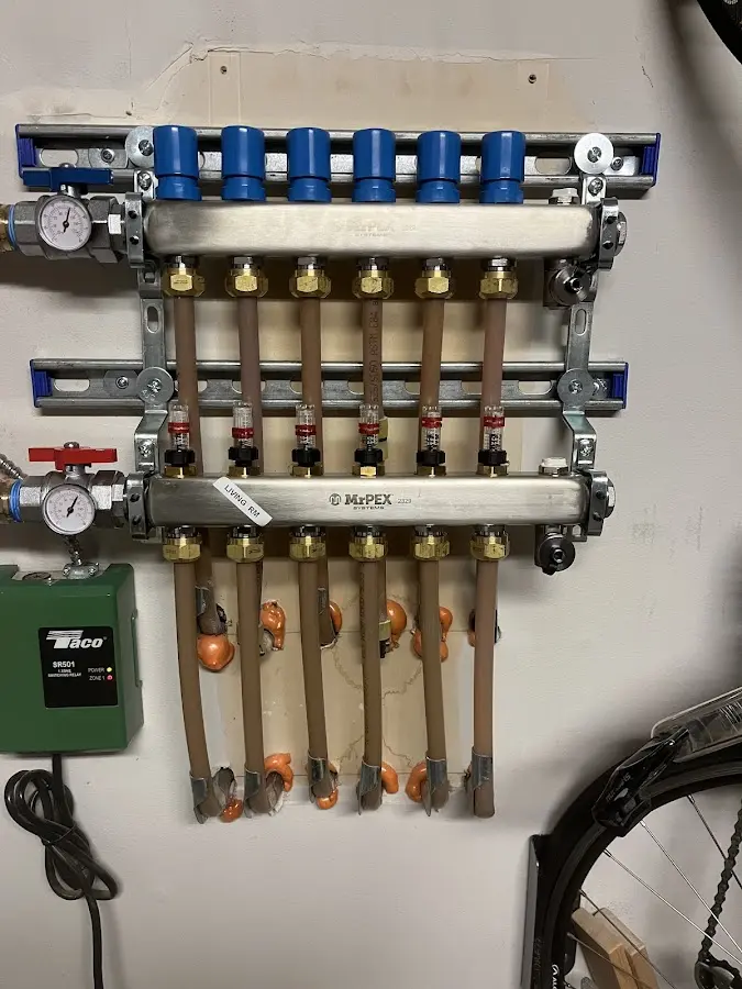 Plumber performing Water Heater Repair at a residential property in Greenville